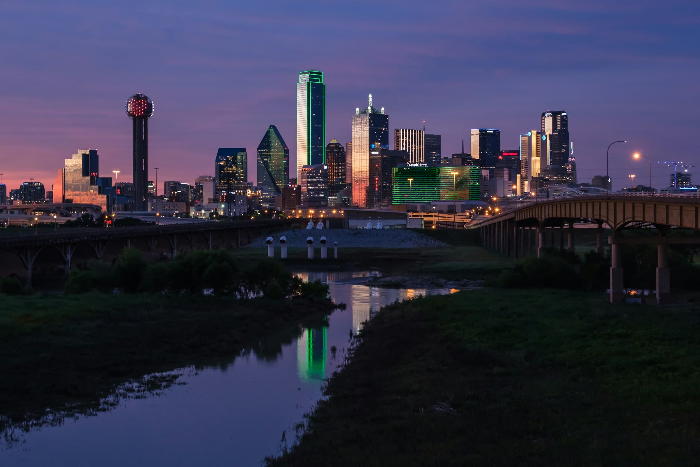 Dallas skyline reflected in the Trinity River at sunset